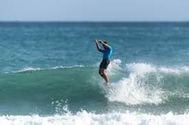 Aerial fan-turn off the lip on a Pāpāmoa wall, Pāpāmoa surf spot, Bay of Plenty, New Zealand.