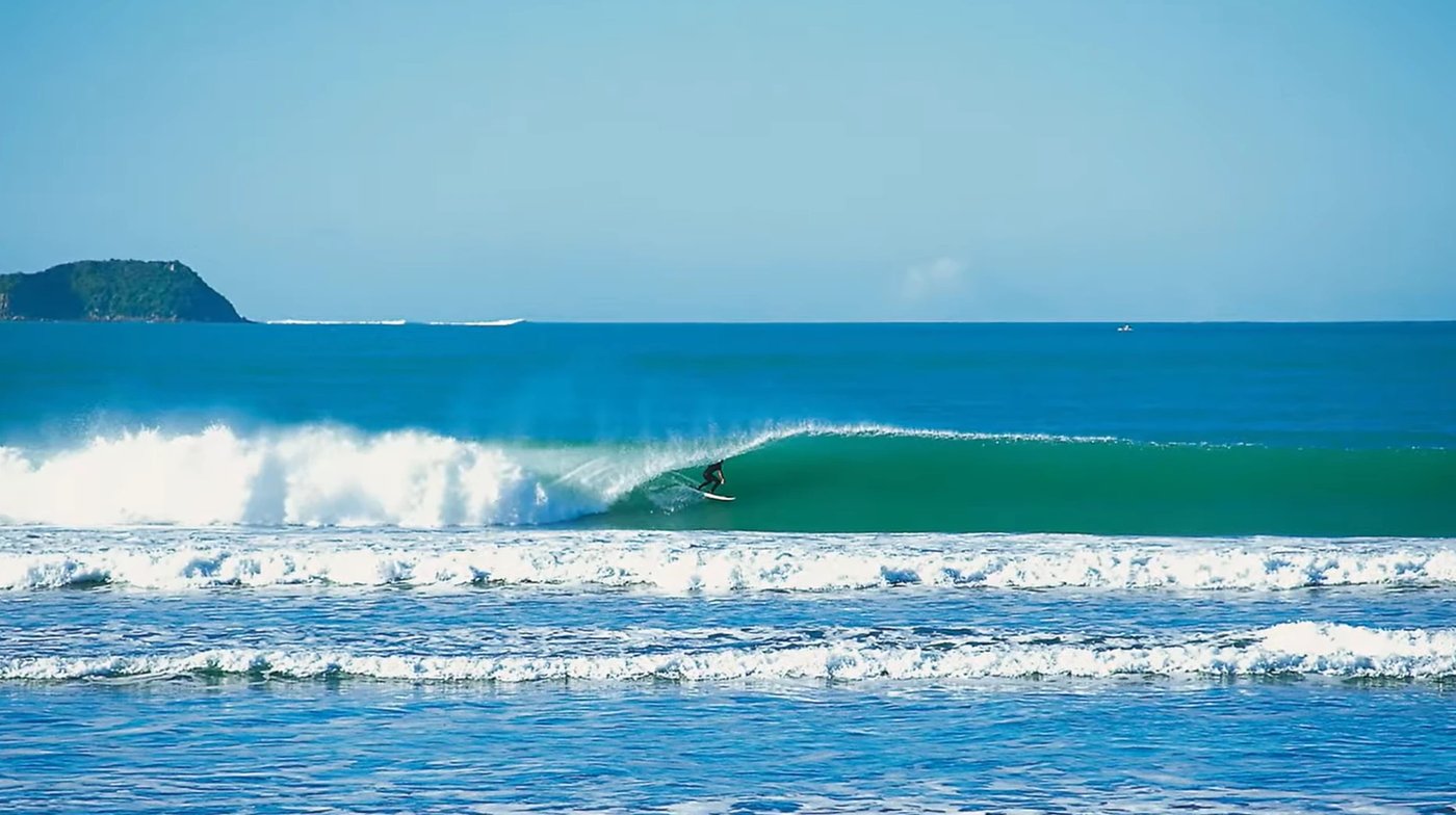 On a smaller, cleaner day the point throws perfect blue walls, an island sitting out on the Catlins horizon, Papatowai surf s